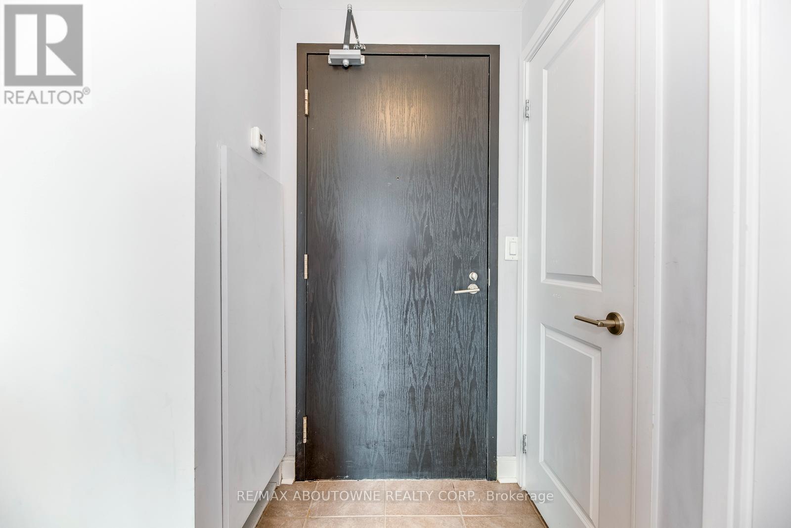 A door with a handle and a doorknob is in the center of the image.