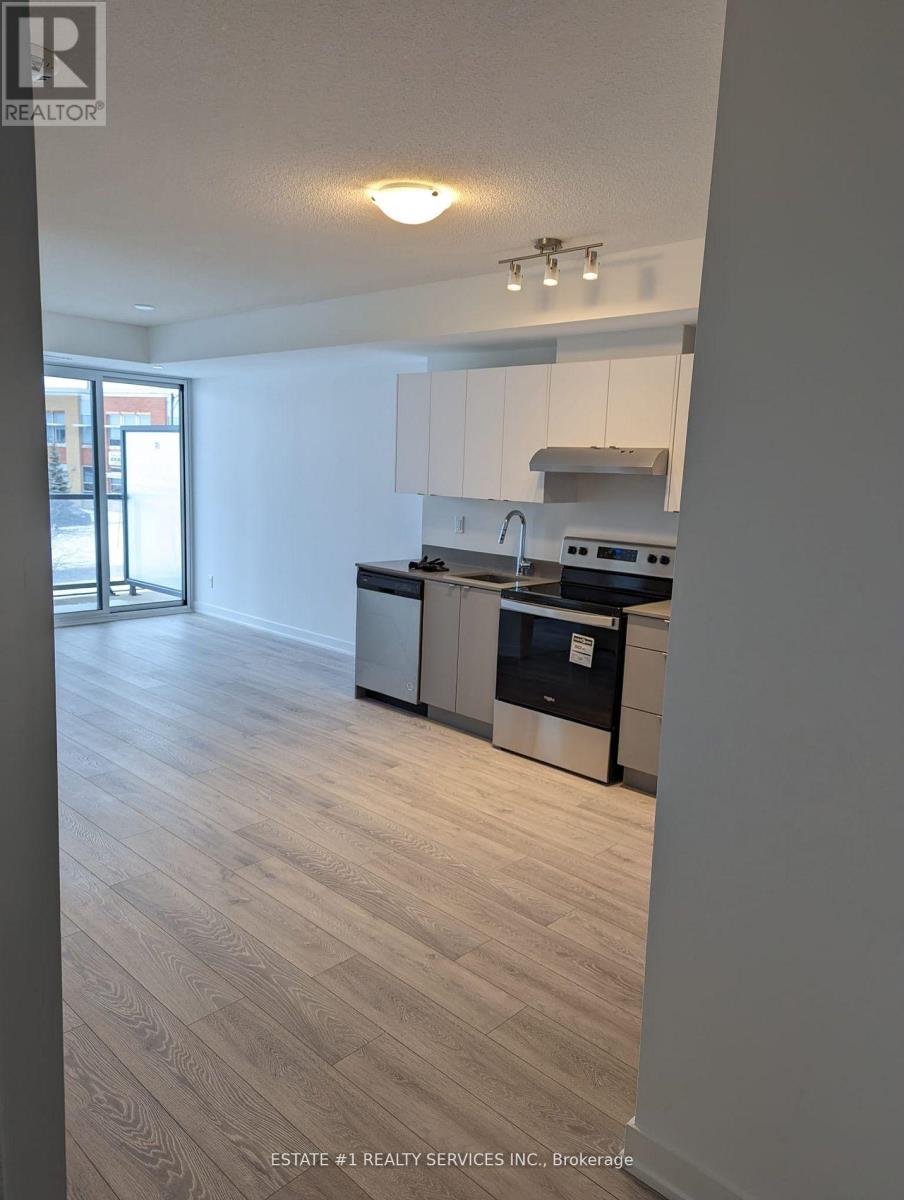 A kitchen with white cabinets and a stainless steel dishwasher.