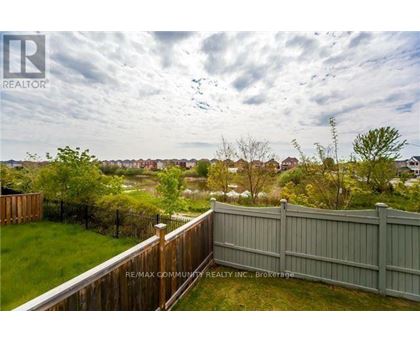 A view from a balcony overlooking a residential area.