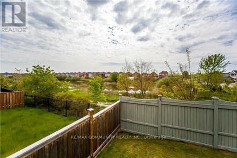 A view from a balcony overlooking a residential area.