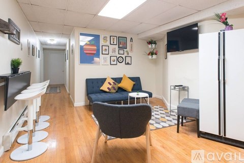 A living room with a blue couch and a television.