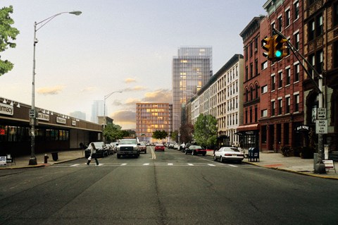 A city street with cars and buildings in the background.