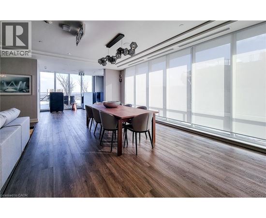 A dining room with a table and chairs is shown.
