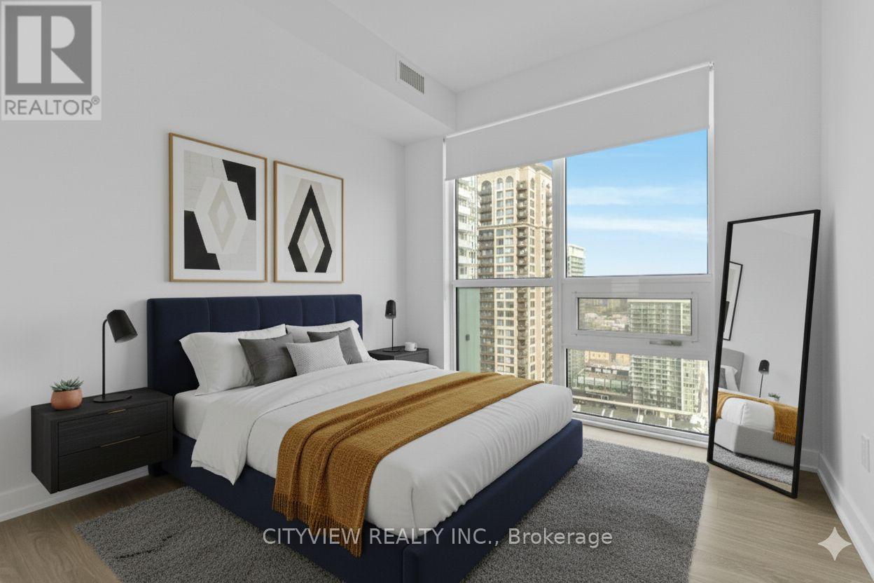 A bedroom with a large bed and a view of a cityscape through the window.