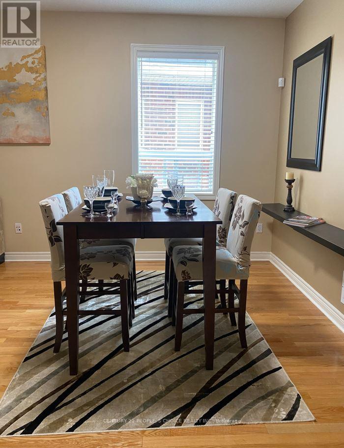 A dining room with a table set for six.