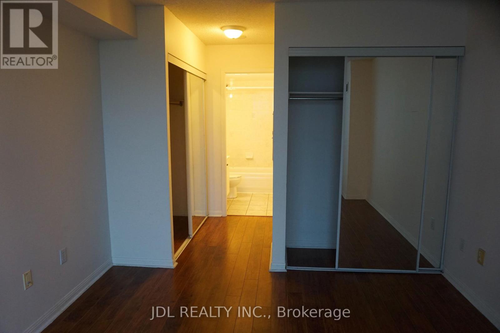 A room with a doorway leading to another room.
