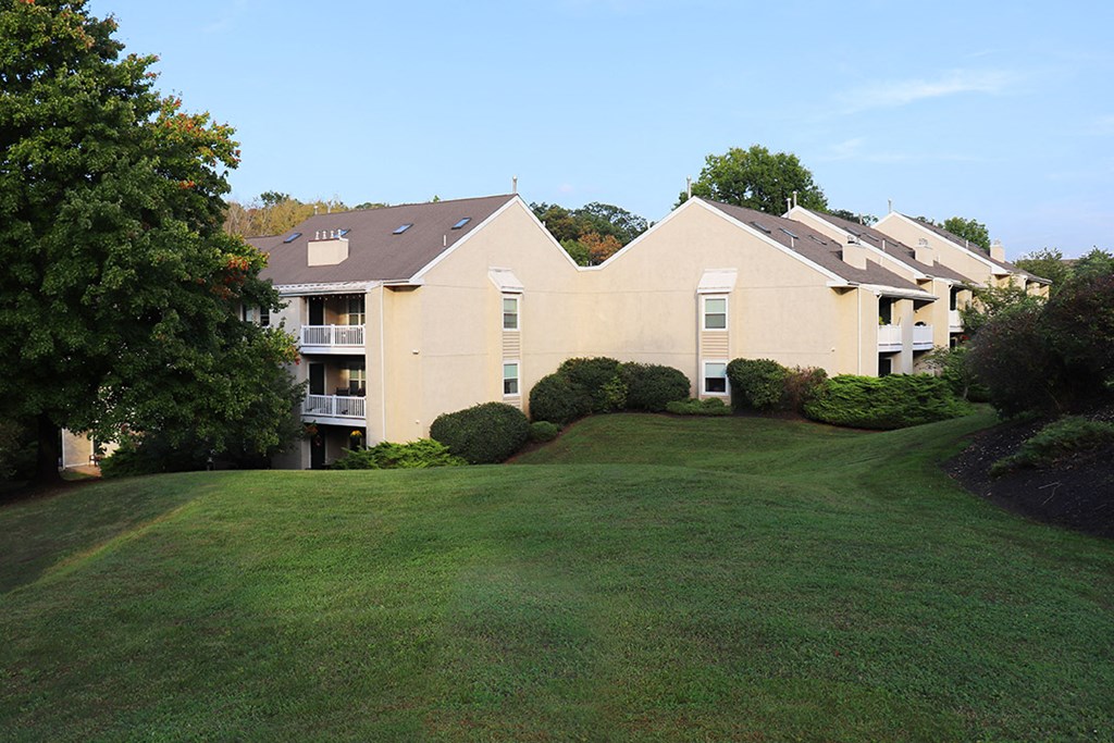 a large yard in front of an apartment building