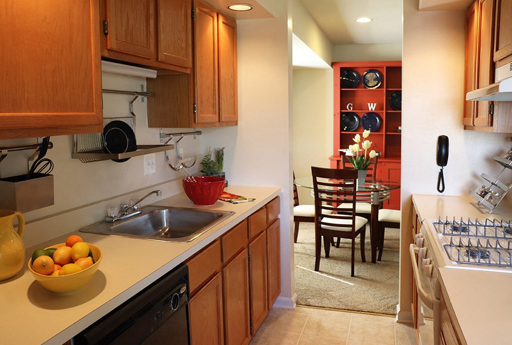 a kitchen and dining room with a table and chairs