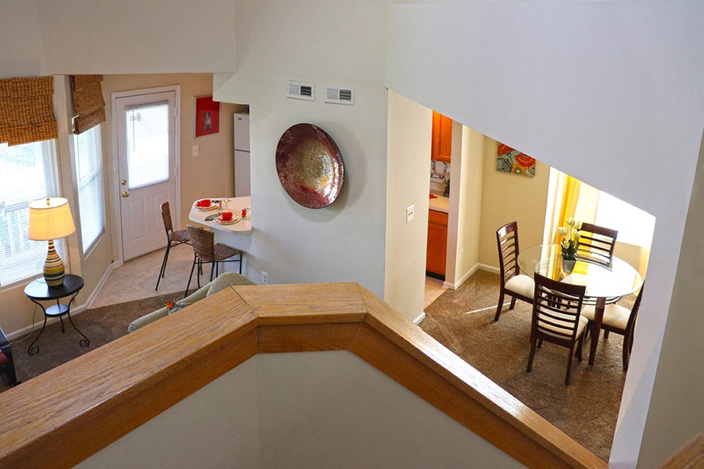 a living room and dining room with a bath tub and a table