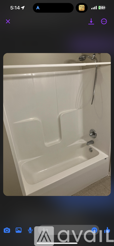 A white bathtub with a silver faucet is shown.
