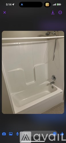 A white bathtub with a silver faucet is shown.