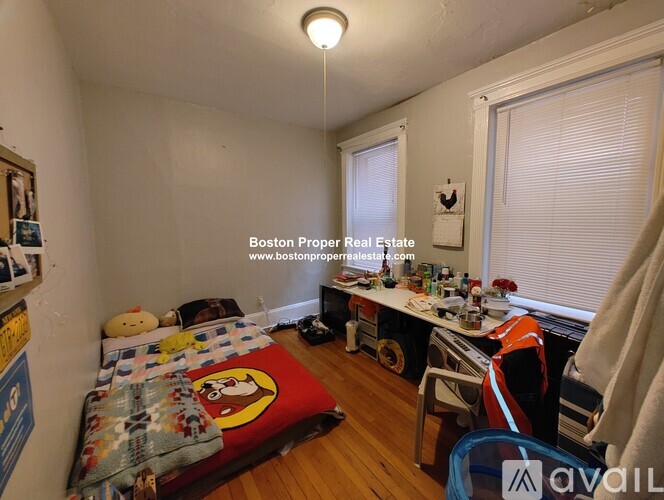 A room with a bed, desk, and chair is available for rent.