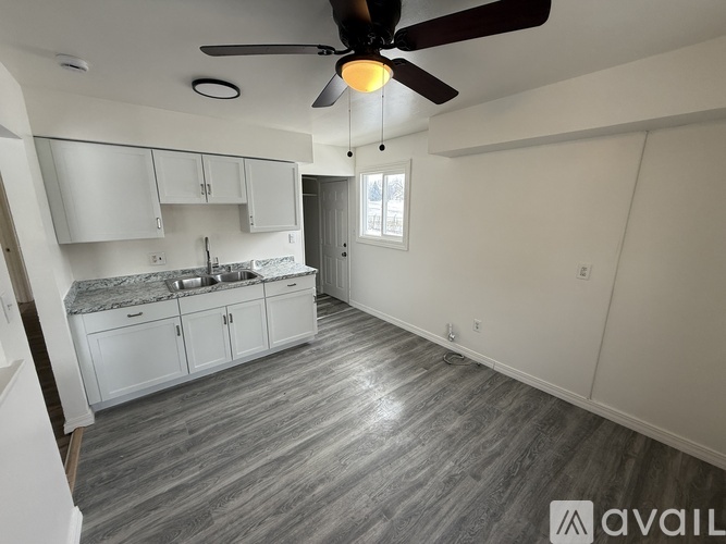A kitchen with a fan and a countertop.