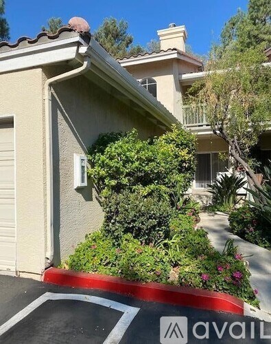 A house with a driveway in front of it.