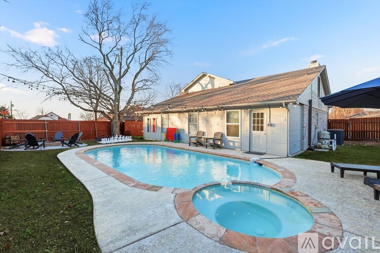 A house with a pool in the backyard.