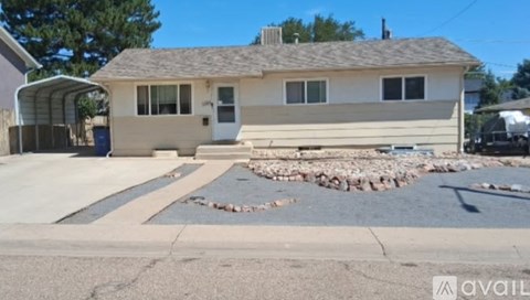 A house with a driveway in front of it.