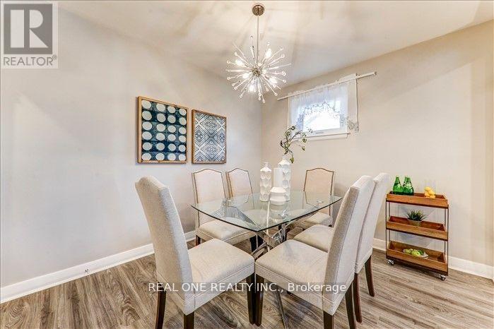 A dining room with a glass table and chairs.