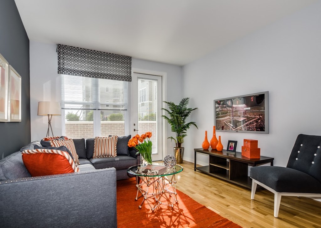 Living Room With Private Balcony at The Monarch, East Rutherford, NJ