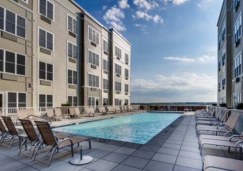 a swimming pool in the middle of two apartment buildings