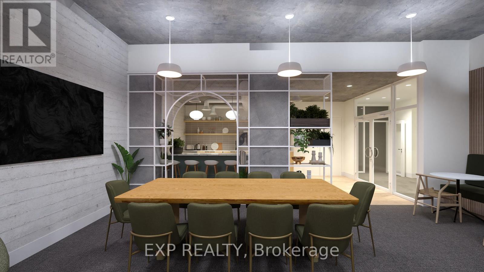 A dining room with a large table and chairs.