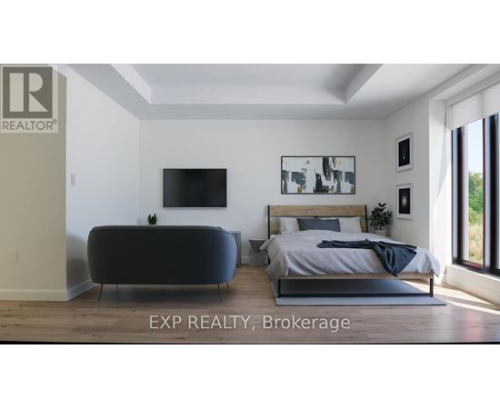 A bedroom with a bed, a sofa, and a television.