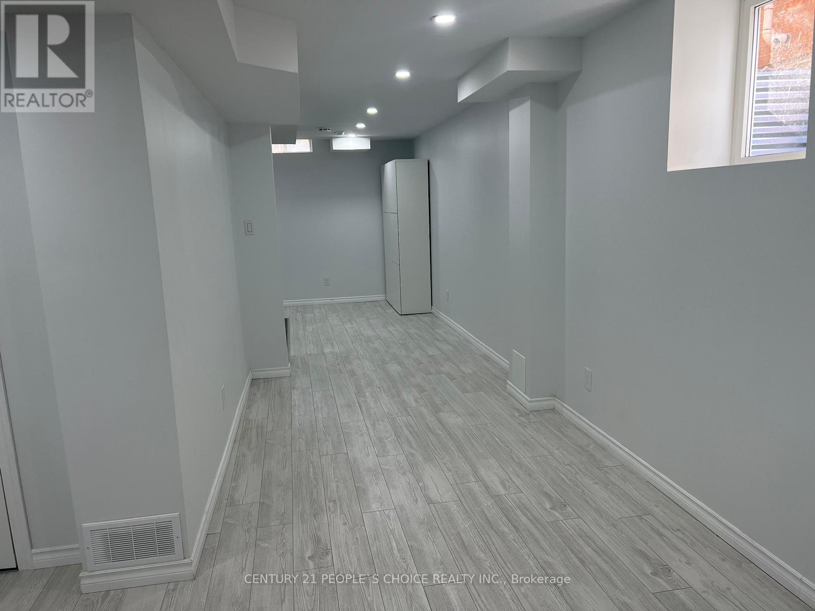 A long hallway with a door at the end.