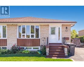 A house with a brown front door and a white window.