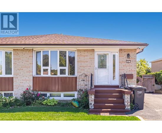 A house with a brown front door and a white window.