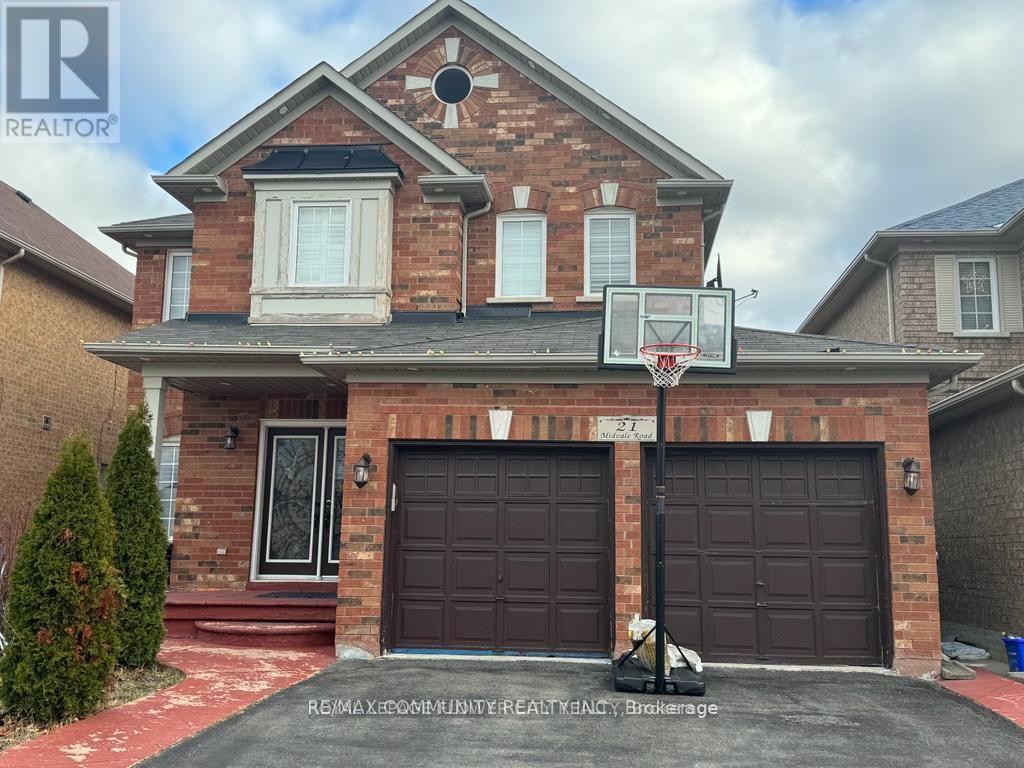 A house with a basketball hoop in front.