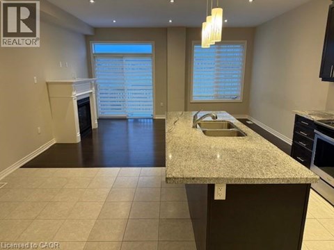 A kitchen with granite countertops and a sink.