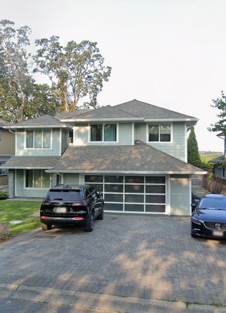 A house with a black car in front of it.