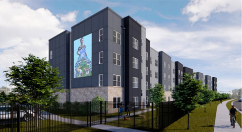 A modern building with a large mural on the side.
