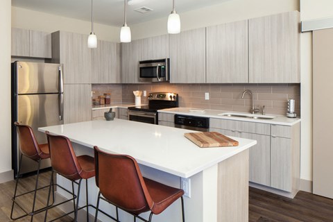 a kitchen with a white counter top