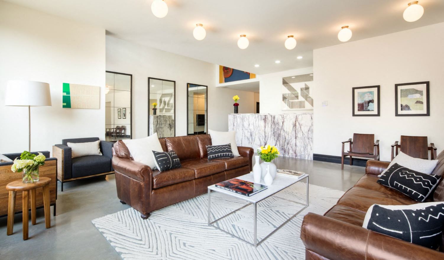 a living room with couches and a coffee table
