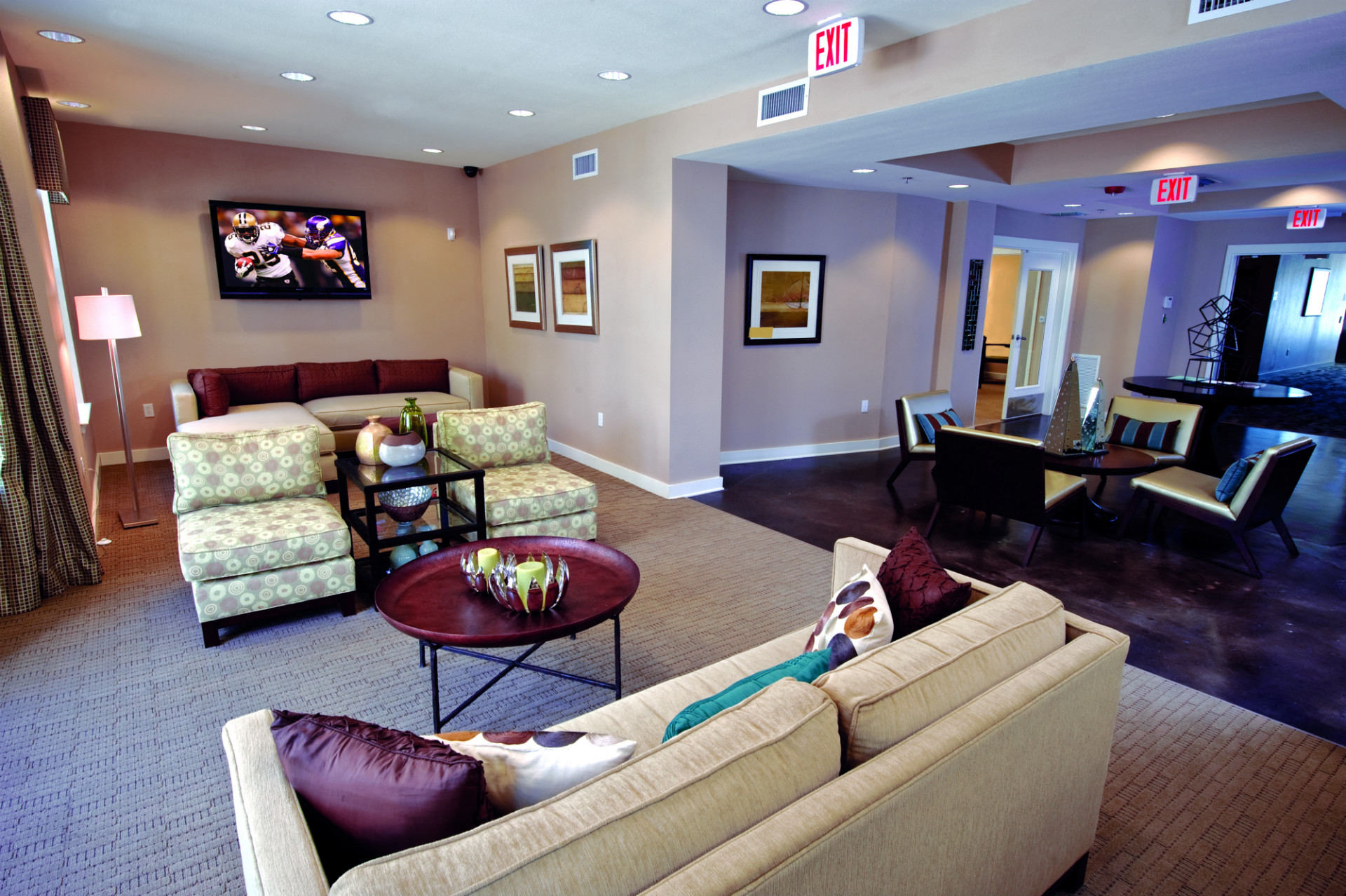 a living room with couches and chairs and a table