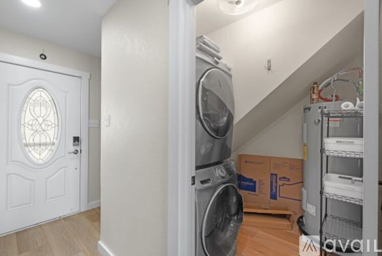 A laundry room with a washer and dryer in it.