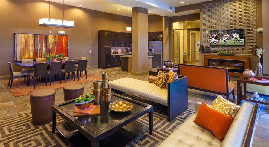 a living room with a couch a table and a television