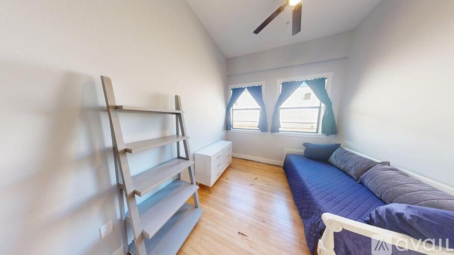 A room with a bunk bed and a single bed.