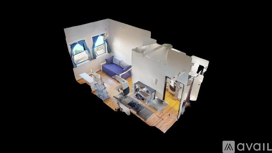 A 3D image of a room with a bed, desk, and chair.
