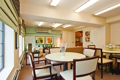 a dining room with a table and chairs