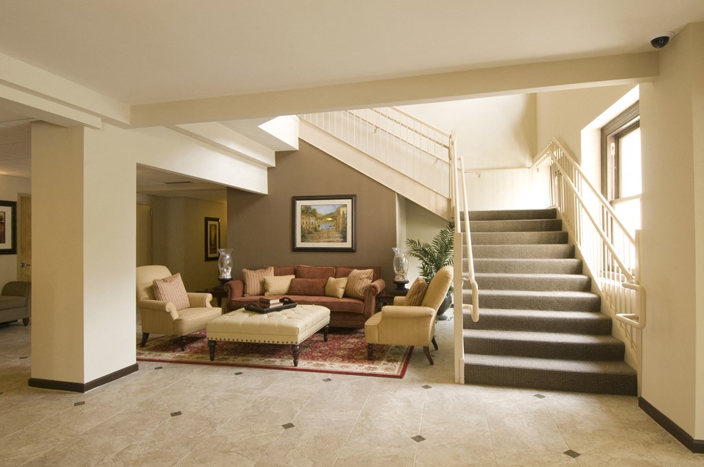a living room with a staircase in a house
