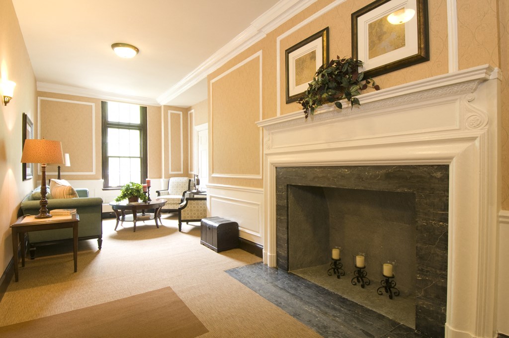 a living room filled with furniture and a fireplace