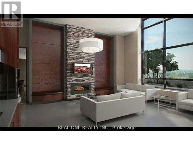 A modern living room with a stone fireplace and a large window.
