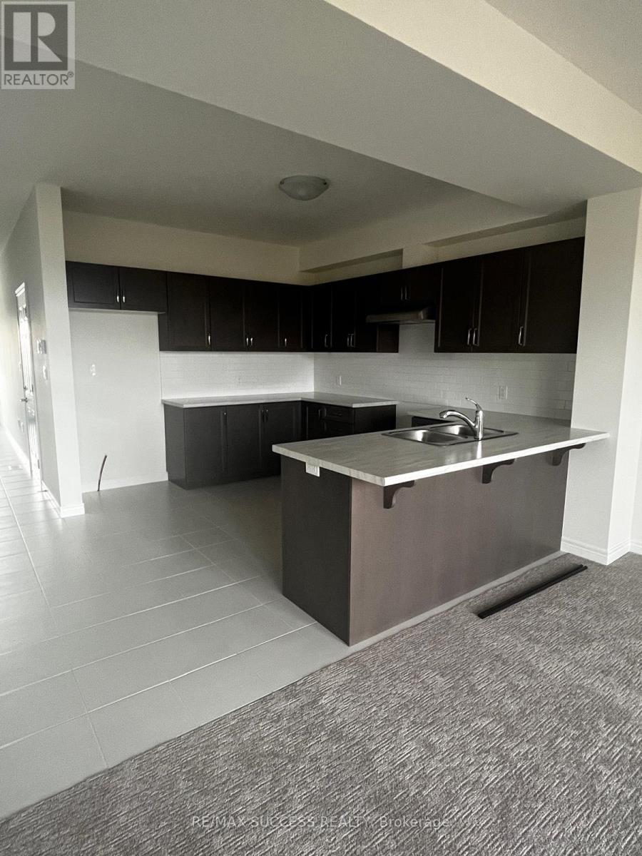 A kitchen with a sink and cabinets.