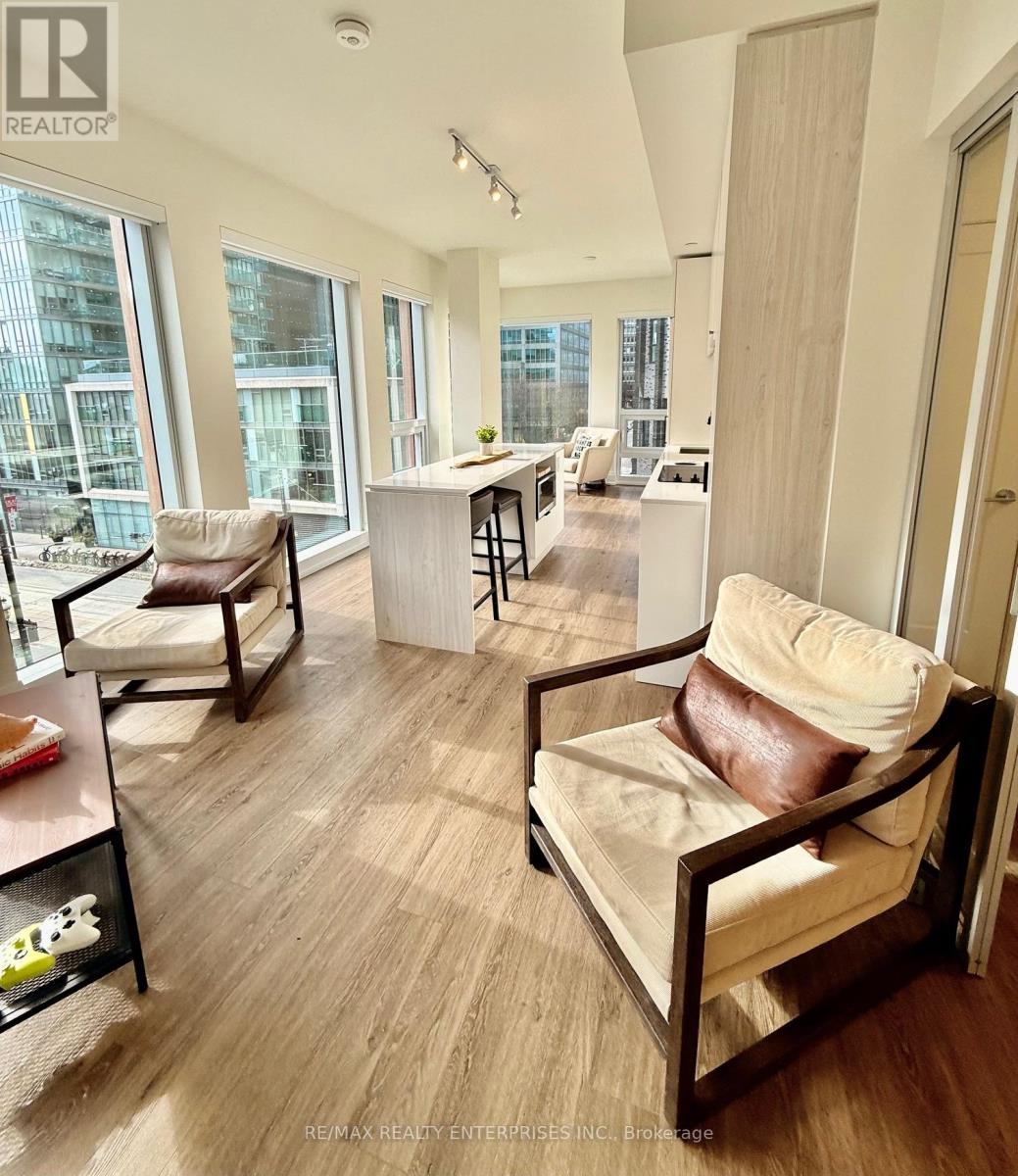 A living room with a couch and a chair.