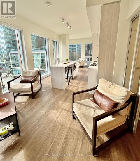 A living room with a couch and a chair.