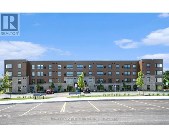A large building with a parking lot in front of it.