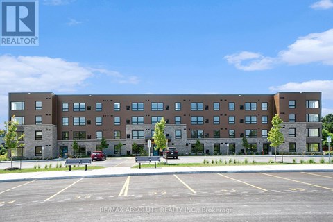 A large building with a parking lot in front of it.