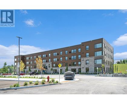 A large building with a parking lot in front of it.