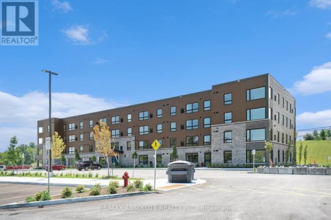 A large building with a parking lot in front of it.